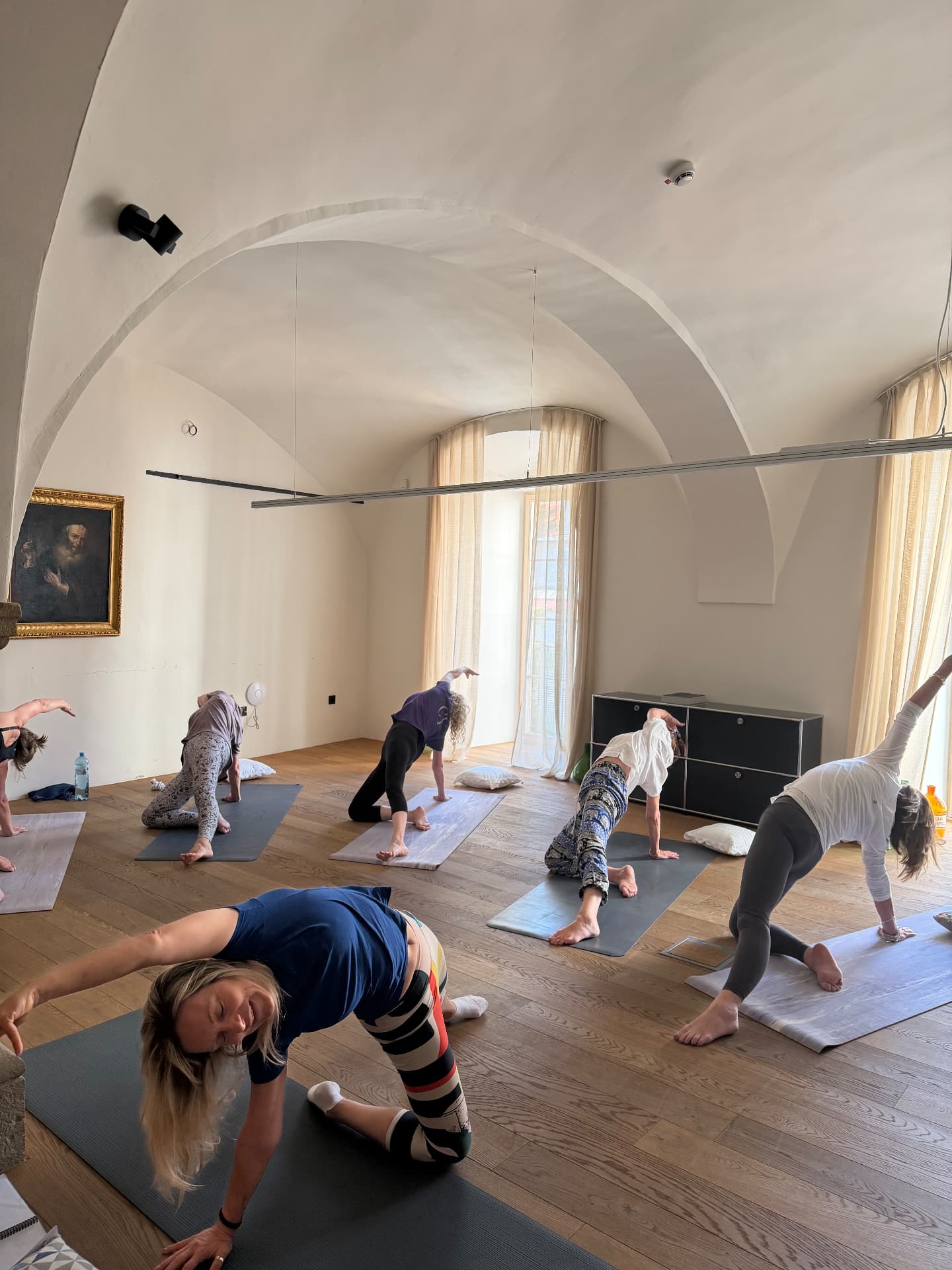 Group in a side-bending pose during the Maribor retreat