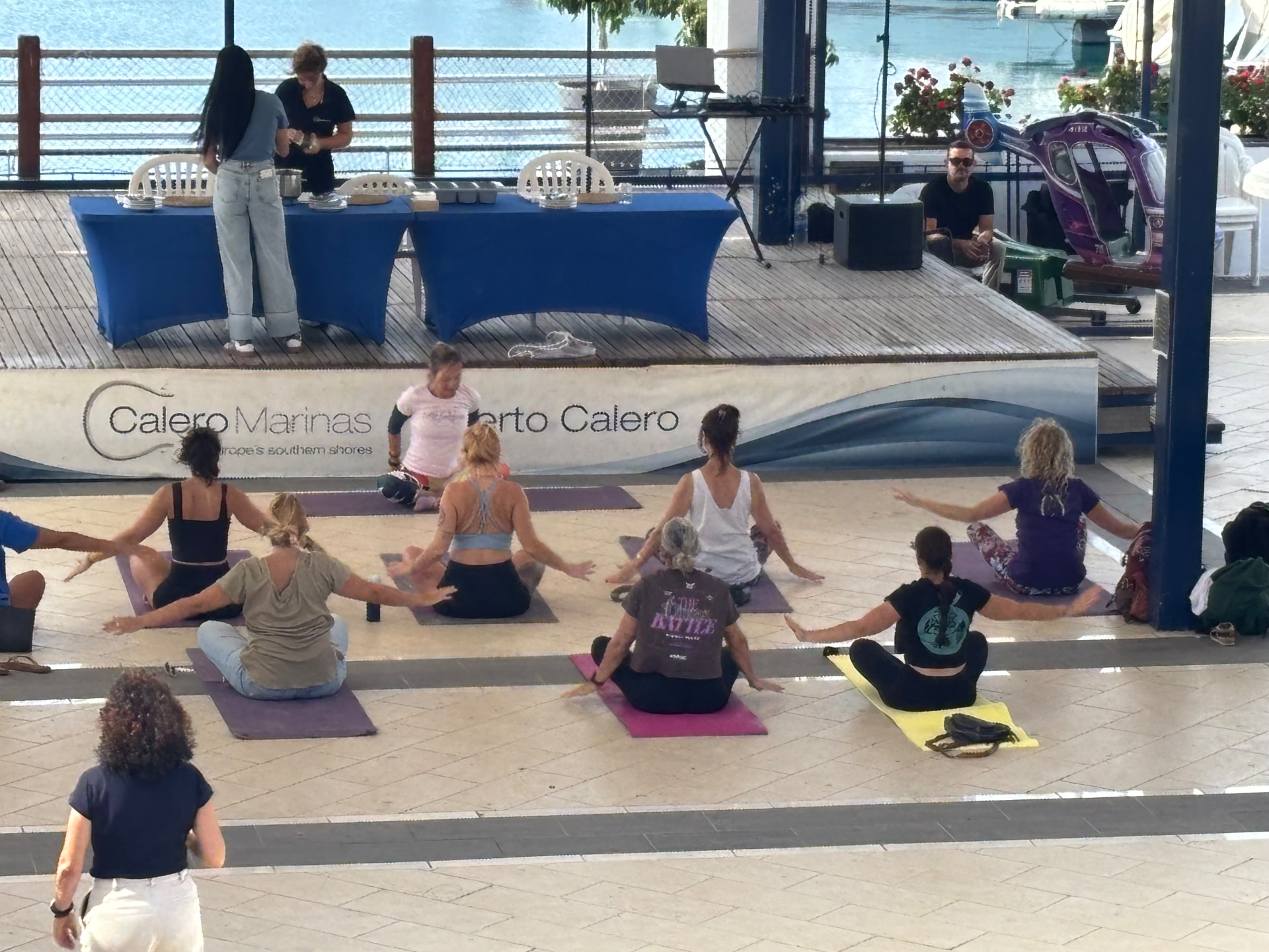 Seated twist during the eco week yoga session at Puerto Calero marina